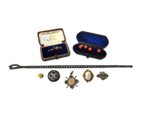 Four gold mounted coral dress studs, a silver curb link part of a watch chain, a silver fob medal, a gold, seed pearl and red