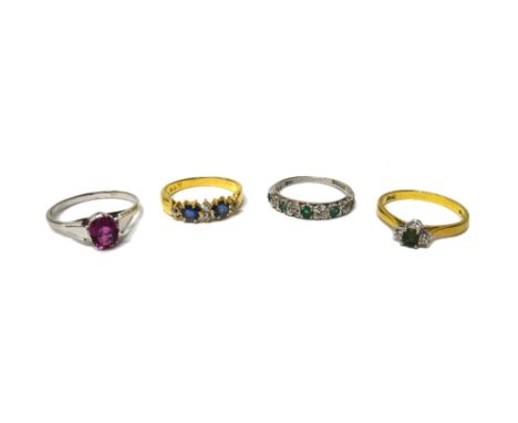 A gold ring, claw set with two oval cut sapphires and with four cushion shaped diamonds mounted at intervals, an 18ct gold, d