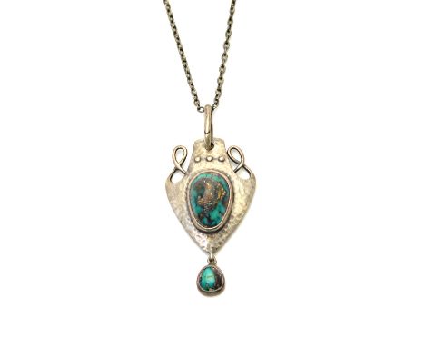 A silver and turquoise matrix Art Nouveau pendant, by Merle Bennett & Co, of panel shaped form, with a beaded and wirework su