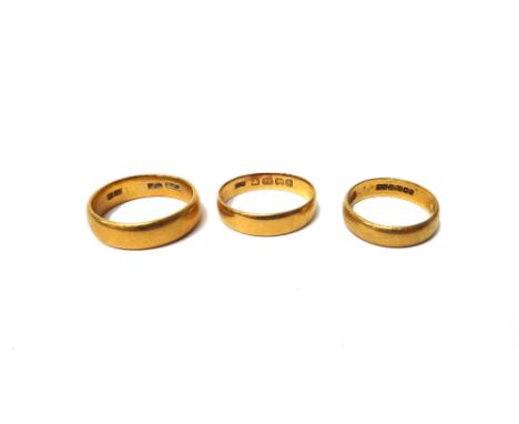 A 22ct gold plain wedding ring, Birmingham 1922 and two further 22ct gold plain wedding rings, combined weight 14.5 gms, (3).