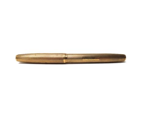 A 9ct gold cased Watermans fountain pen, with a signed gold nib, detailed 14 CT, the exterior of the pen engine turned and en