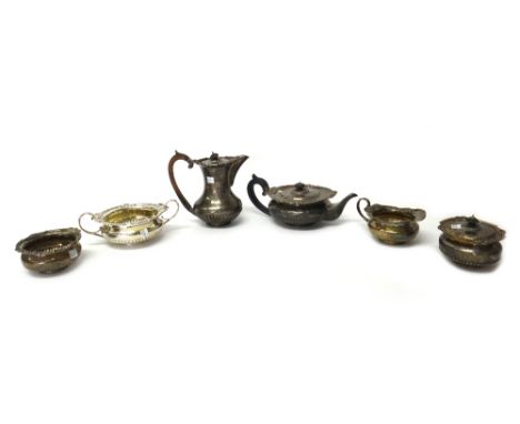 A Victorian silver three piece tea set, of compressed circular form, the applied cast borders, decorated with masks and scrol