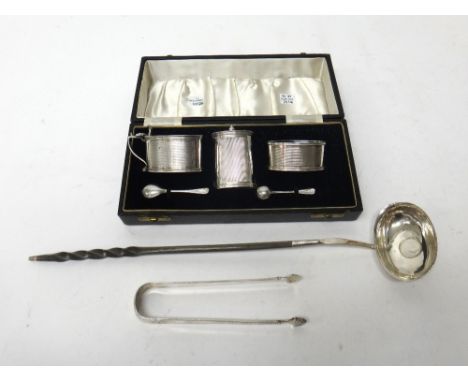 Silver, comprising; a three piece condiment set, of oval form, with engine turned decoration, Birmingham 1947, with two silve