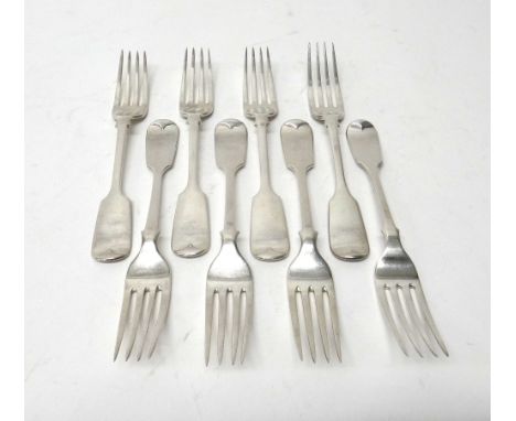 A set of six fiddle pattern dessert forks, London 1932 and two Victorian silver fiddle pattern dessert forks, London 1855, co