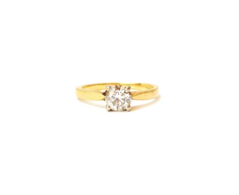 An 18ct gold and diamond single stone ring, claw set with a circular cut diamond, ring size approx I and a half, with a case.