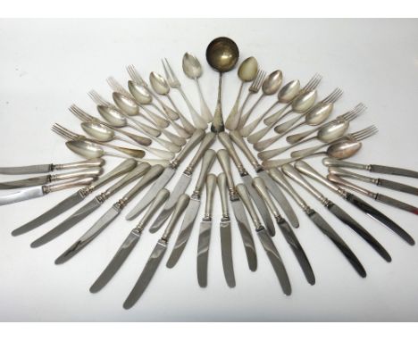 An Austrian part table service of flatware, comprising; twelve tablespoons, ten table forks, a soup ladle, a pair of servers 