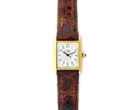 A Must de Cartier silver gilt rectangular cased lady's quartz wristwatch, the signed dial with Arabic numerals, date of the m