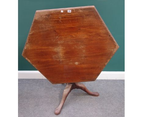 A mid-18th century mahogany occasional table, with hexagonal snap top on bird cage mount and tripod base, 106cm wide x 76cm h