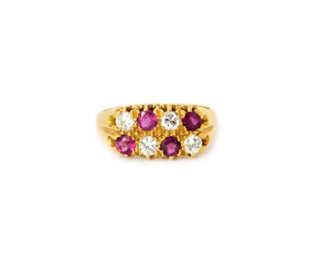 An 18ct gold, ruby and diamond ring, mounted with four circular cut diamonds, alternating with four circular cut rubies, in a