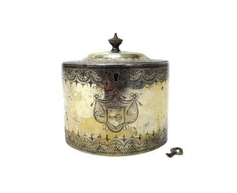 A George III silver tea caddy, of oval lidded form, the body and domed lid with engraved decoration with central shield shape