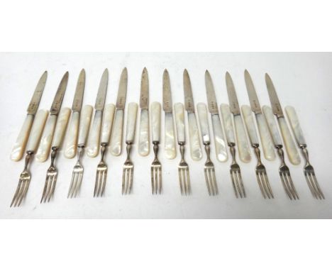 Twelve pairs of dessert or fruit knives and forks, having silver blades and prongs and with mother of pearl handles, Birmingh