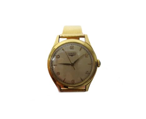 A Longines gold circular cased gentleman's wristwatch, the signed silvered dial with alternating gilt Arabic and arrow shaped