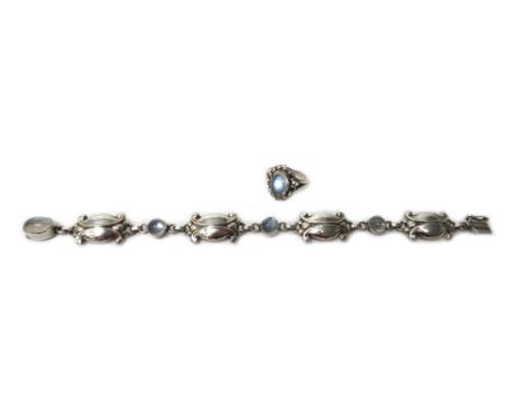 A Georg Jensen silver and moonstone bracelet, in a panel shape link design, collet set with oval cut moonstones at intervals,