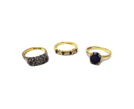 An 18ct gold, sapphire and diamond seven stone half hoop ring, mounted with four circular cut sapphires alternating with thre