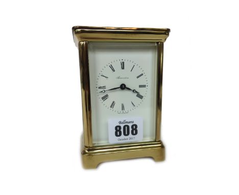 A modern gilt brass cased carriage cock, the white enamel dial detailed 'ALEXANDERS' with a single train movement, 11.5cm hig