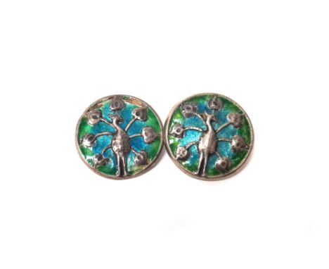 Four Liberty & Co silver, blue and green enamelled buttons, each decorated with a stylized bird in display, all detailed L & 