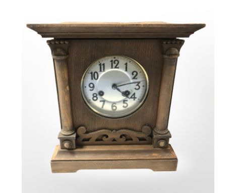 An early 20th century beech eight day mantel clock, height 31 cm.