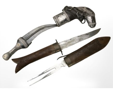 An Arabic jambiya knife in ornate silver plated sheath, length 29 cm, together with an Indian carving knife and fork in carve