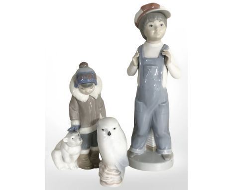 Two Lladro figures comprising boy in dungarees and boy with polar bear, together with a Royal Copenhagen figure of an owl.