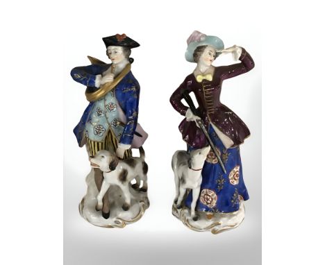 A pair of 20th century German porcelain figurines in the style of Meissen, depicting a lady and gentleman in hunting attire w