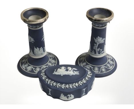 A pair of Wedgwood Jasperware squat candlesticks, height 12 cm, and a shaped trinket box