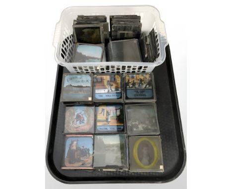 A collection of glass photographic negatives and slides including views of London, landscapes, portrait photographs, etc.