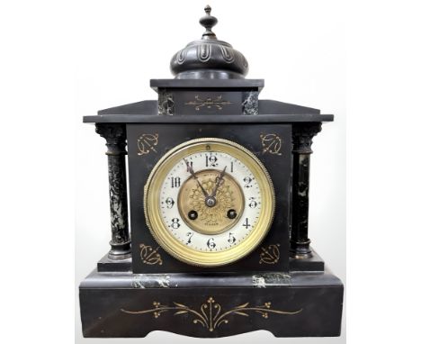 A Victorian black slate and marble eight day mantel clock, retailed by Wm. Hope, Hexham, with pendulum and key, height 32 cm.