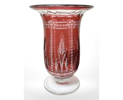 A Victorian flash cut cranberry glass trumpet vase with clear foot, height 28 cm.