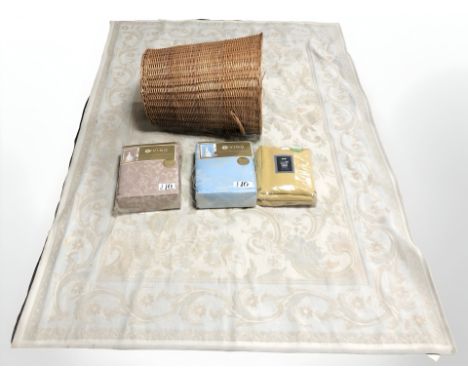 A machine made rug, two pairs of fully lined Jacquard curtains, 225 cm x 225 cm, and a wicker laundry basket.