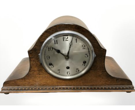 An early 20th century oak Napoleon hat mantel clock, height 24 cm 