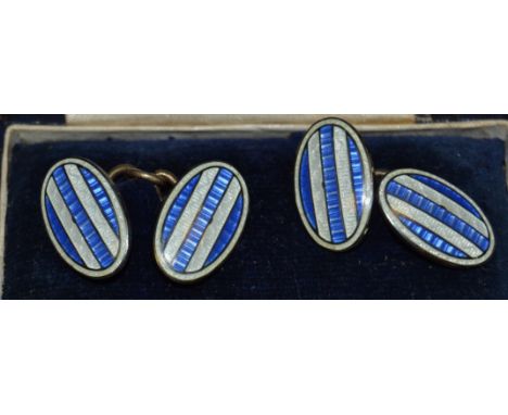 A set of early 20th Century silver and enamel cufflinks