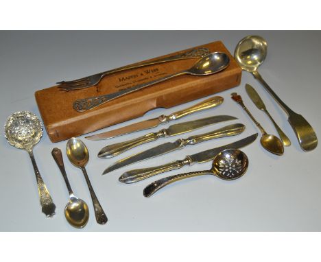 A silver pickle fork and conforming spoon manufactured by Mappin & Webb, hallmarked Sheffield 1946; four silver hafted fruit 