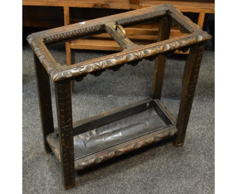 A late Victorian carved oak stick stand, c.1900
