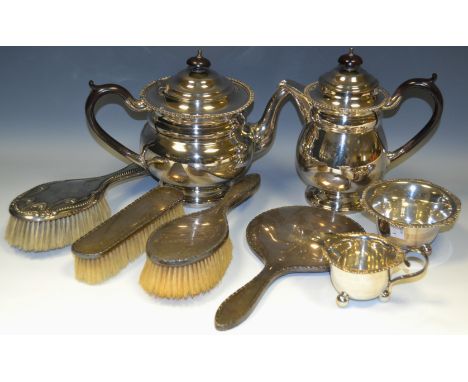 A four piece E.P.N.S tea service comprising teapot, water jug milk and sugar;  a silver three piece dressing table set;  a si