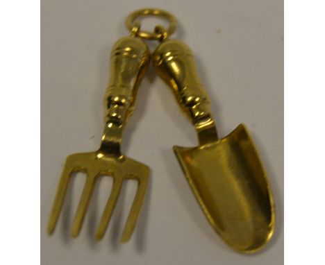 A 9ct gold miniature gardening fork and trowel
