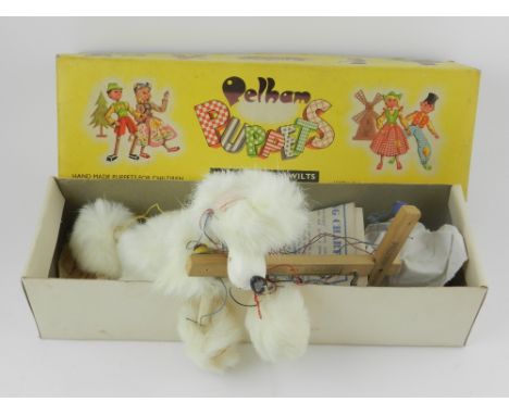 A boxed Pelham puppet of a poodle, in original box