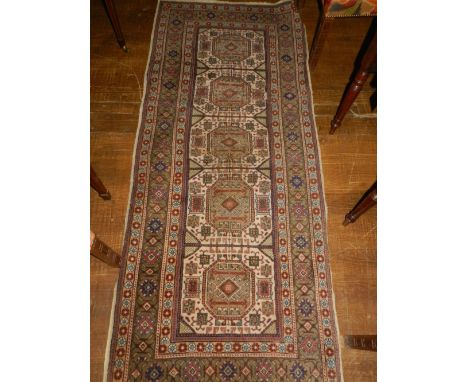 A Persian style cream ground carpet, decorated with elephant pad motifs, multi-bordered and fringed L.220cm W.90cm