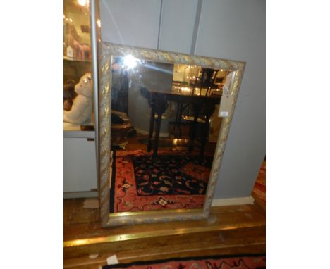 A gilt framed wall mirror. 