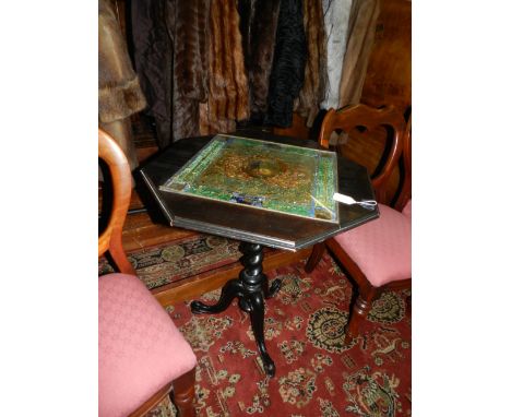 A late 19th century octagonal tea table, the top inlaid with christolian and verre eglomise panel, raised on a barley twist c