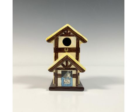 Hand made and hand painted small, glossy porcelain horse stable. It feature a yellow scalloped roof and a couple of horses pe