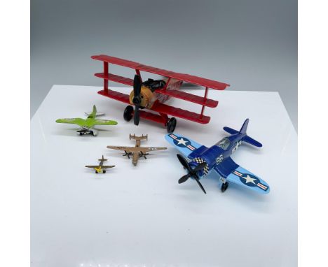 Adorable assortment of winged vehicles that includes a larger red Tootsietoy biplane, a Tootsietoy blue fighter, a small Zylm