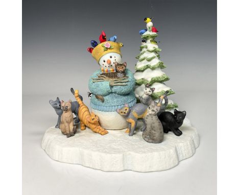 Crafted resin, hand painted of a Snowman with beautiful blue sweater and surrounded with cats and birds. Decorated with a tre