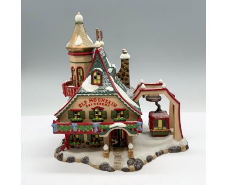 This hand painted porcelain figurine is called Elf Mountain Ski Resort. Department 56 backstamp. It comes with its original b