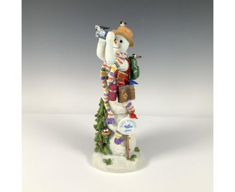 Resin, hand painted snowman collectable with binoculars and hat. This figure towers above a pine tree with a small bird nest 
