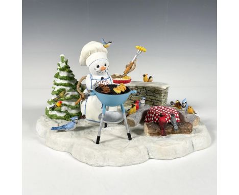 Hand painted resin with different textures of a small winter-themed figure featuring a snowman grilling in the snow, with a g