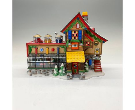 This pair includes the Lego Building Creation Station hand painted porcelain figurine # 56.56735 with light kit and figurine 