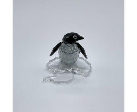 Part of the Kingdom of Ice and Snow collection. A clear and black crystal of an Antarctic flightless birds, with frosted feet