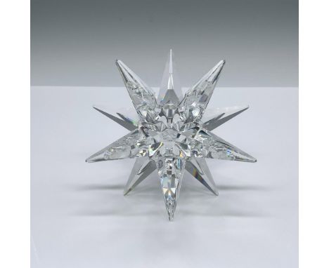 Part of the Our Candleholders collection. A clear crystal candlestick holder shaped as a star with many points. Swarovski swa