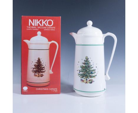 A white thermos coffee pot features a classically decorated tree design that complements other Nikko Ceramics holiday pattern