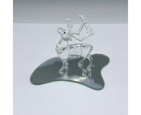 Part of the Exquisite Accents collection. A clear crystal caribou with colored eyes. Also includes a mirror base with reindee